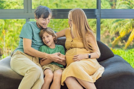Cozy family time at home as pregnant mom, dad, and son enjoy shared moments on the sofa, creating heartwarming memories and cherishing their time together.