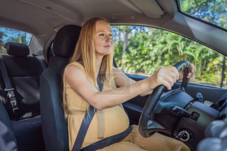 Pregnant woman driving with safety belt on in the car. Confident and capable, a pregnant woman takes the wheel, driving with care and determination as she navigates the journey of motherhood.