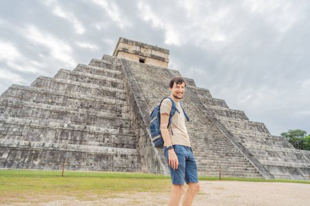 tourist man observing the old pyramid and temple of the castle of the Mayan architecture known as Chichen Itza. These are the ruins of this ancient pre-columbian civilization and part of humanity.