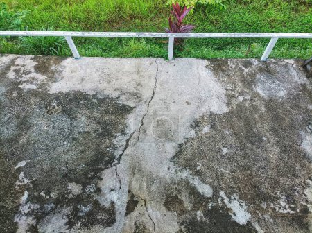 the cement terrace of the house has cracked