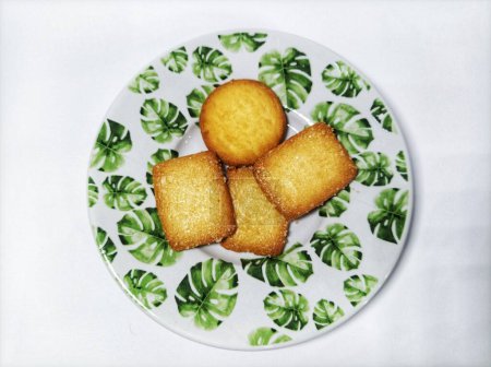 several biscuits on a plate on a white background