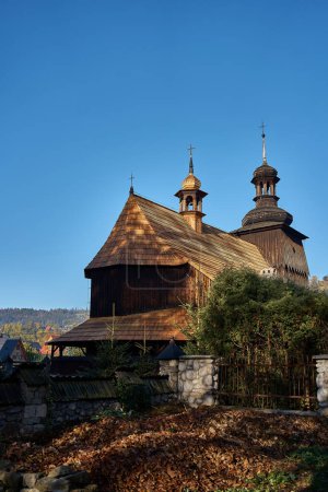         a wooden church in autumn Zakopane at dawn                       