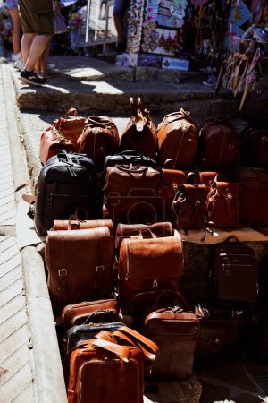                leather bags and backpacks are sold on the street                