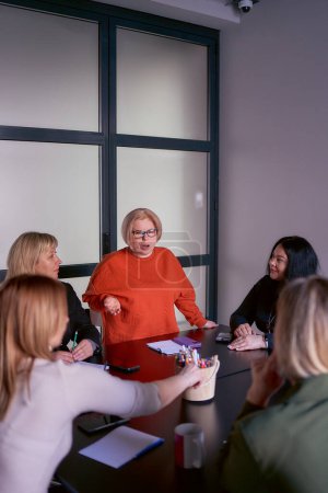 person with a disability speaks at a meeting in the office              