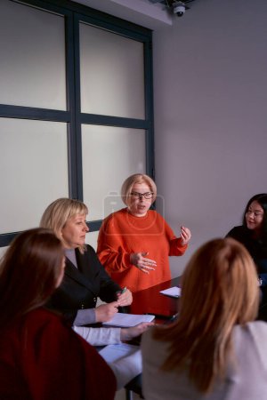 person with a disability speaks at a meeting in the office              