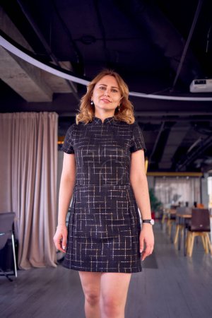 a stunning model in business mini dress catwalk in modern office space                              
