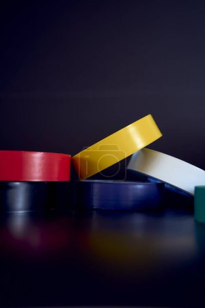 Photo for A set of colored insulating tape on a black background - Royalty Free Image