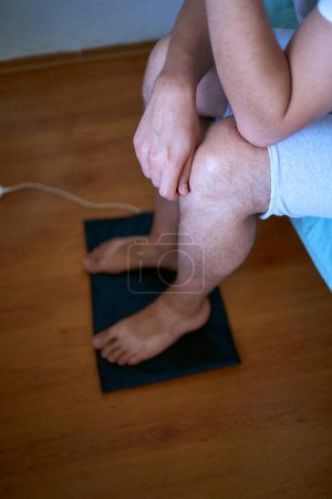 the man put his feet on the grounding wedge, self-soothing, relaxation