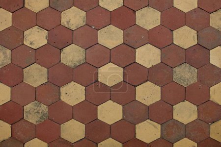 Texture pattern on the floor is made out of various stones cut into the shape of hexagon.