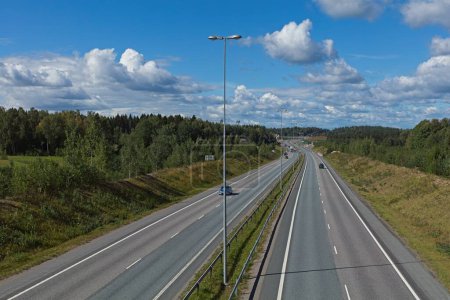 View over Helsinki to Turku E18 highway in summer with clouds in the sky, Lohja, Finland.