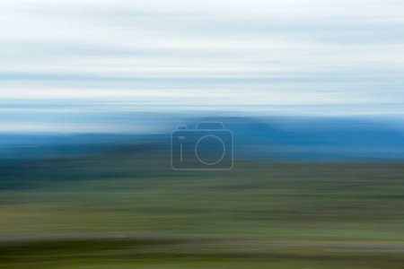 ICM intentional camera movement view of Saana fell in Finland in the summer from Storfjord, Norway.