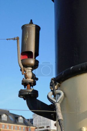 Closeup of old whistle on a steam ship.