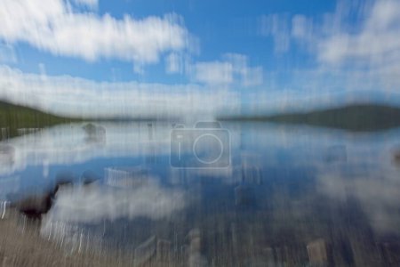 Intentional camera movement (ICM) of lake Kilpisjrvi in cloudy summer weather, Enonteki, Lapland, Finland.