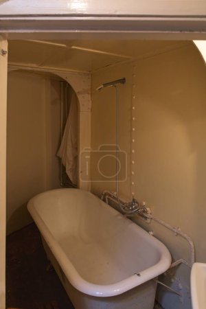 Photo for Bathroom with bathtub and shower on a vintage steamship. - Royalty Free Image