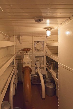 Photo for Storage room with shelving and pipes on a vintage steamship. - Royalty Free Image