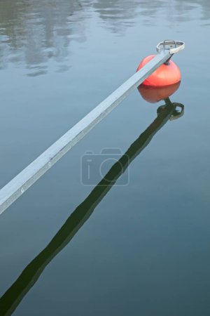 Shaft with buoy in unfrozen water in winter, Tirmo, Porvoo, Finland.