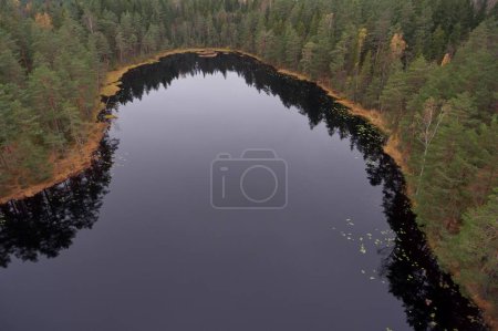 Aerial landscape view of lake Vaara-Musta in autumn, Espoo, Finland.