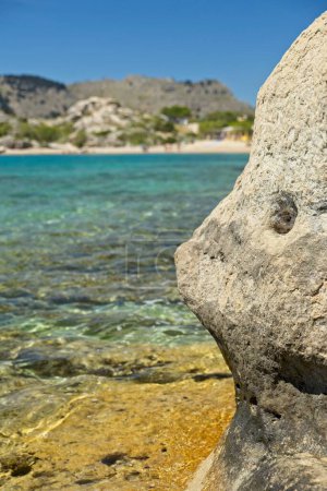 Rock formation on seashore with clear sky, Kolymbia, Rhodes, Greece.