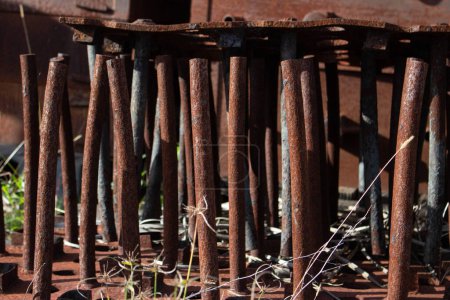 Photo for Rusty old metal engineering pipes no longer used and left to just rust in the elements. - Royalty Free Image