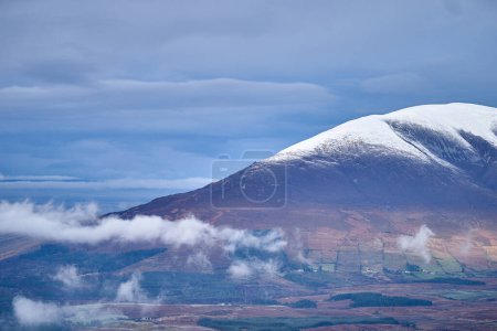 Photo for Snow on Nephin mountain dramatic sky low clouds Ireland. High-quality photo - Royalty Free Image