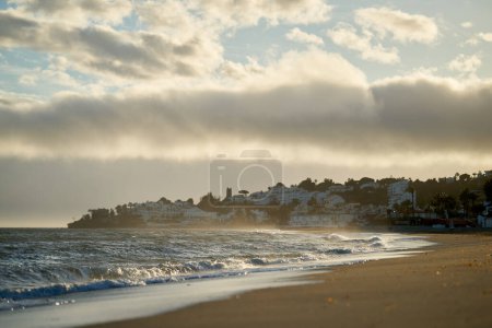 Photo for Spain Andalusia evening coast beach line waves on sand. High quality photo - Royalty Free Image