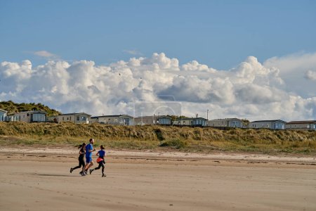 Photo for People running playing relaxing on the beach. High quality photo - Royalty Free Image