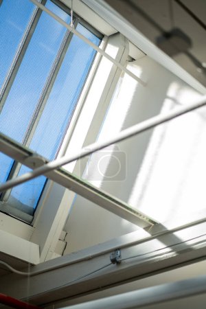 a window with a skylight in a building