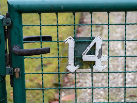 House number 14 on garden door