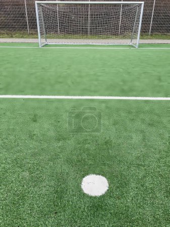 penalty spot in front of a soccer goal