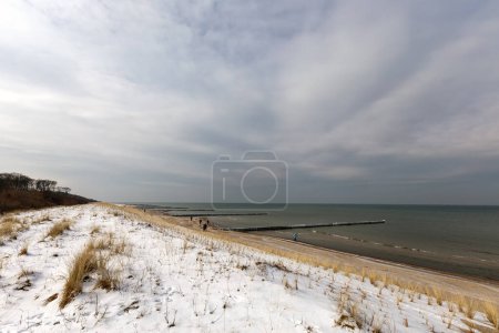 snow covered dunes at the beach of the Baltic Sea in Germany 