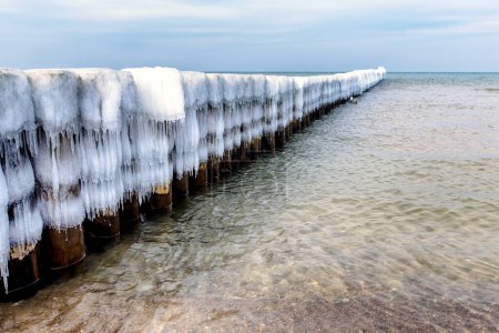 Ice covered groynes at the Baltic Sea in the north of Germany