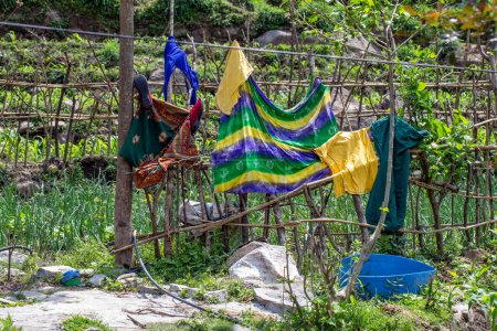 Clothes hung on a fence to dry