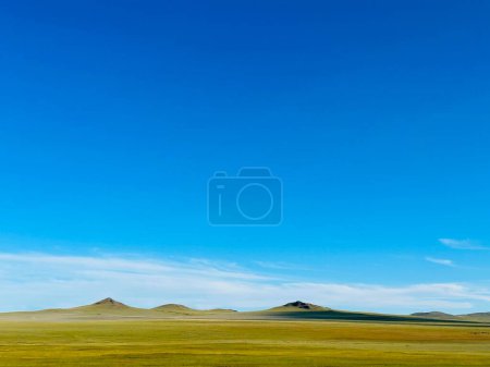 beautiful landscape with a field of grass and blue sky, Tov, Mongolia