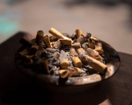 Photo for Dirty ashtray full of cigarette butts - Royalty Free Image
