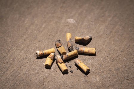 Photo for Cigarette butts were scattered on the floor - Royalty Free Image