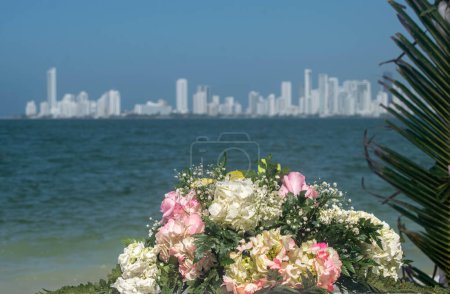 Bouquet of flowers for a wedding with a view of the ocean and cityscape of Cartagena, Colombia