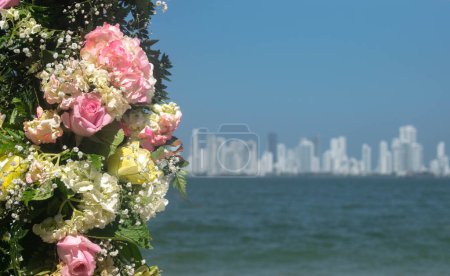 Photo for Matrimonial bouquet of flowers with ocean and city view - Royalty Free Image