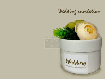 Photo for Card with a picture of a wedding box as a gift for wedding guests. Caption: Wedding Gifts for guests. Copy space, beige background - Royalty Free Image