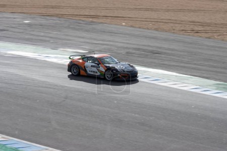 Photo for 11-20-2022 PORTUGAL, LISBON: Caterham festival - car racing - black and orange porsche sports car with a bunch of stickers on the corpus. Mid shot - Royalty Free Image