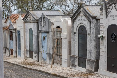 Photo for February 22, 2023 Lisbon, Portugal: Alto de Sao Joao Cemetery - family crypts decorated with Christian crosses. Mid shot - Royalty Free Image