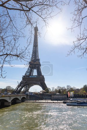 Photo for April 4, 2023 Paris, France: Seine River at the Eiffel Tower. Vertical shot - Royalty Free Image