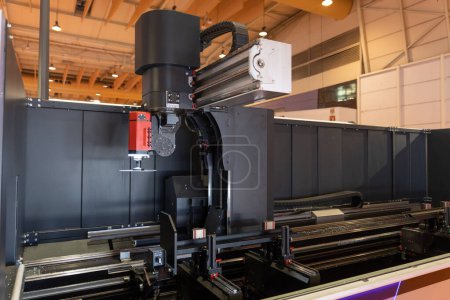 Photo for Software-controlled grinding machine at the expo. Mid shot - Royalty Free Image