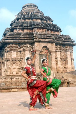 Photo for Dancers performing classical traditional odissi dance in front of Konarak Sun temple, Konarak, Orissa, India - Royalty Free Image