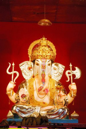 Photo for Richly decorated idol of lord ganesh elephant headed god for Ganpati festival year 2008 Jilabya Maruti Mandal tulsibaug at Pune , Maharashtra , India - Royalty Free Image
