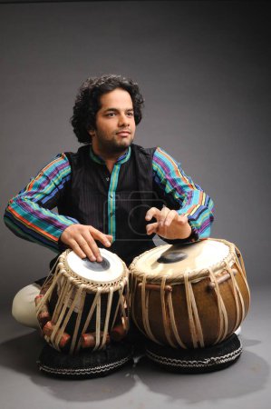 Photo for Male Musician playing tabla - Royalty Free Image