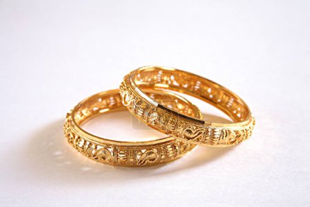 Photo for Concept , kangan gold bangle worn on wrist on white background - Royalty Free Image