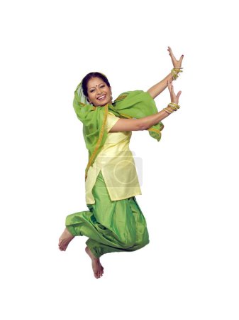 Photo for Sikh lady performing folk dance bhangra - Royalty Free Image