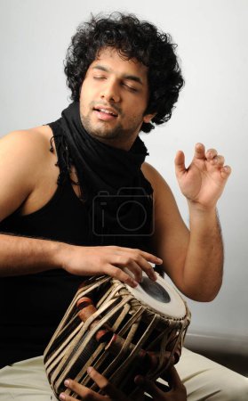 Photo for Musician playing tabla on white background - Royalty Free Image