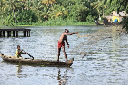 Photo for Family fishing at punnamada lake, Alleppey, Alappuzha, Kerala, India - Royalty Free Image