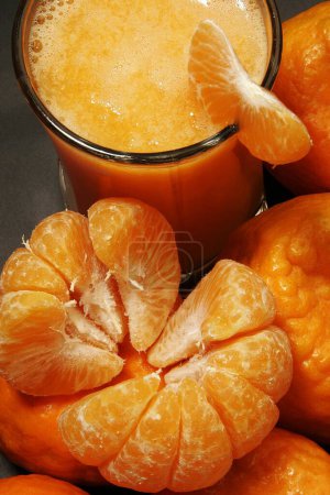 Photo for Fruit , one pealed and other unpeeled oranges with piece on glass of orange juice - Royalty Free Image